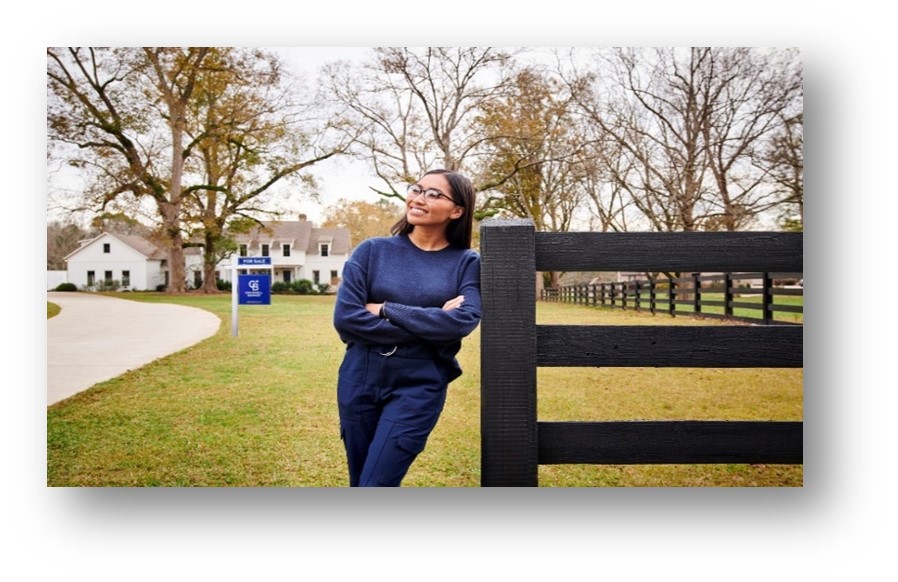 Woman leaning against fence